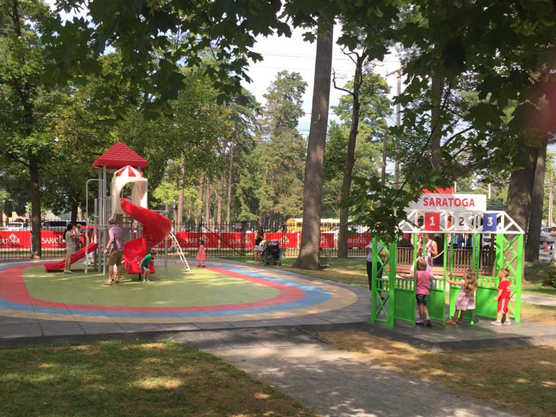 Kids play at the Saratoga Family Zone playground at Saratoga Race Course
