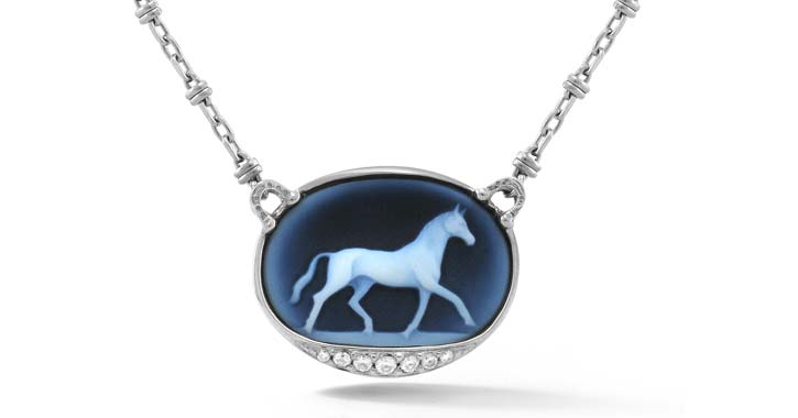 a blue pendant with a horse image