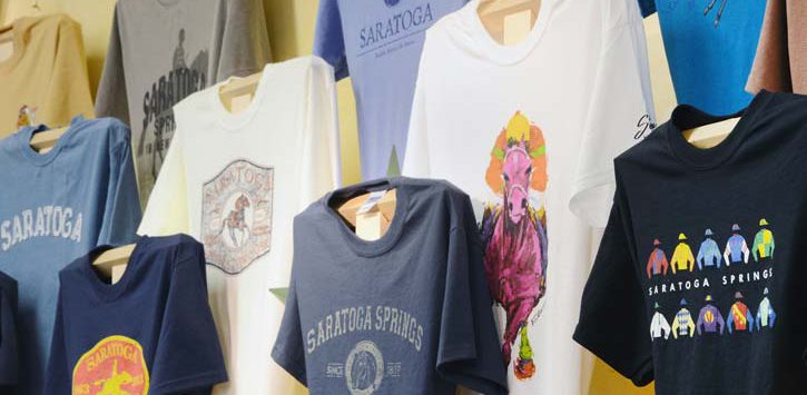 saratoga shirts on a wall