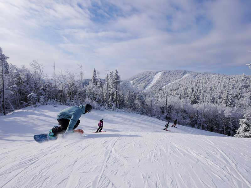 Snowboarders hitting the slopes at Gore Mountain