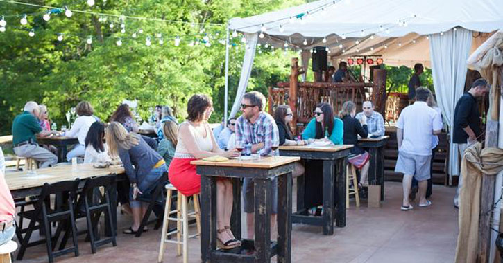 people sitting outside on a patio