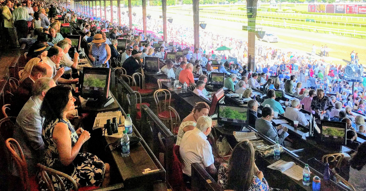 people in seats at race track