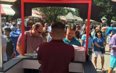 worker at booth at saratoga race course